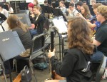 The Cooper City High School concert band warms up before their practice performance. The concert band is a renowned musical success at CCHS. Photo Credit: KAYLA LOKEINSKY